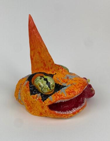 A orange and black toyDescription automatically generated with medium confidence